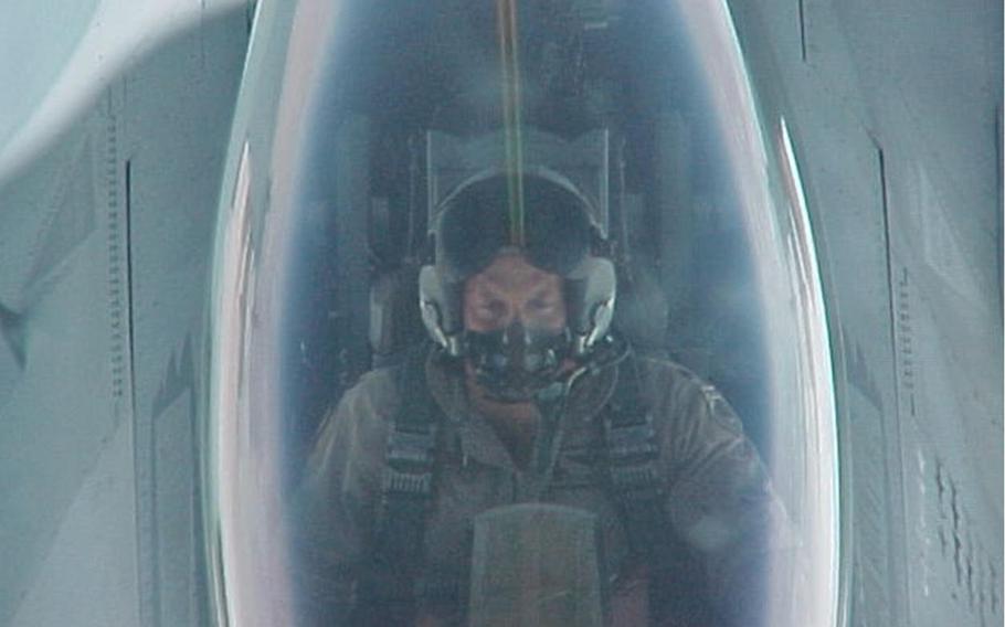 Retired Air Force Lt. Col. Dan Hampton pilots an F-16 Fighting Falcon in this undated photo.