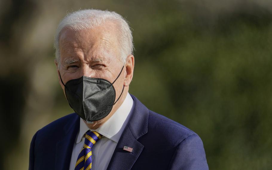 President Joe Biden walks on the South Lawn of the White House after stepping off Marine One, Thursday, Feb. 10, 2022, in Washington. 