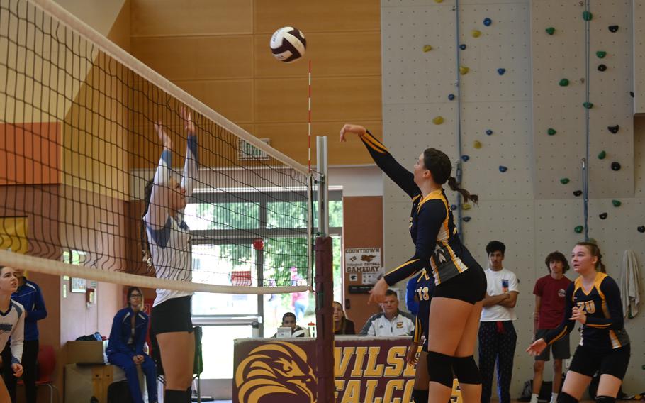 Ansbach’s Kennedy Lange saves the rally and hits the ball back over the net during a scrimmage against Wiesbaden at the Vilseck High School gym on Sept. 2, 2023.