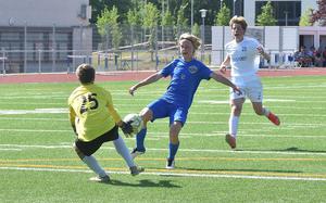 Black Forest Academy goalkeeper Kaleb Kroeker stops an attack on goal from Ramstein's Landon Shockey in the DODEA-Europe boys Division I semifinals on Wednesday, May 18, 2022, at Ramstein Air Base, Germany.