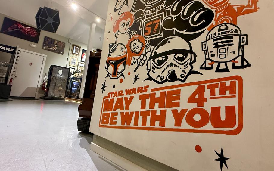 A sign at the museum says May the 4th Be With you.