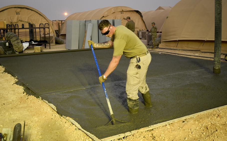 Airman 1st Class Justyn Franklin prepares a concrete foundation for a living area as part of upgrades at Prince Sultan Air Base in Saudi Arabia. U.S. military officials have said similar construction at bases across the Middle East helps protect troops from missile and drone attacks.