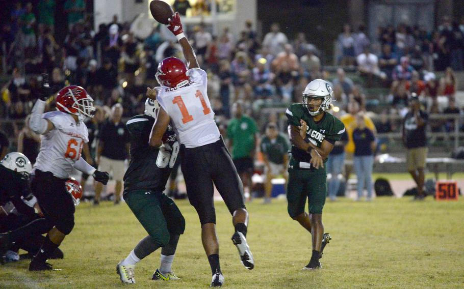 Nile C. Kinnick's Devin Jackson gets a hand on a pass attempt by Kubasaki's Trajon Weaver.