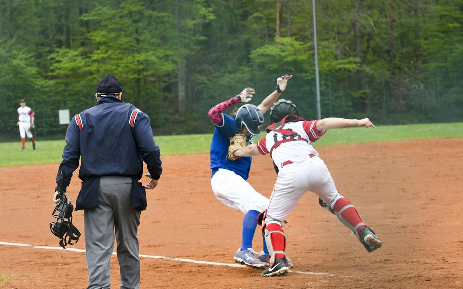 Kaiserslautern's Sawyer Ter Horst tags out Ramstein's Lucas Hollenbeck at home plate in a game Saturday, April 30, 2022, in Kaiserslautern, Germany.