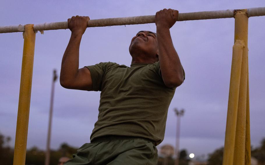 A Marine Corps recruit with Delta Company, 1st Recruit Training Battalion conducts pullups during the Physical Fitness Test at Marine Corps Recruit Depot San Diego on Jan. 9, 2023. The PFT is performed to evaluate a recruit’s level of physical fitness.