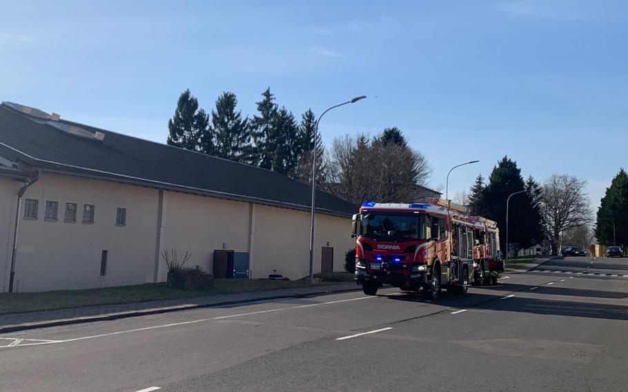 Firefighters respond to KMC Onstage at Kleber Kaserne, Kaiserslautern, Germany, Feb. 13, 2022, after an equipment malfunction activated fire sprinklers and flooded the stage.