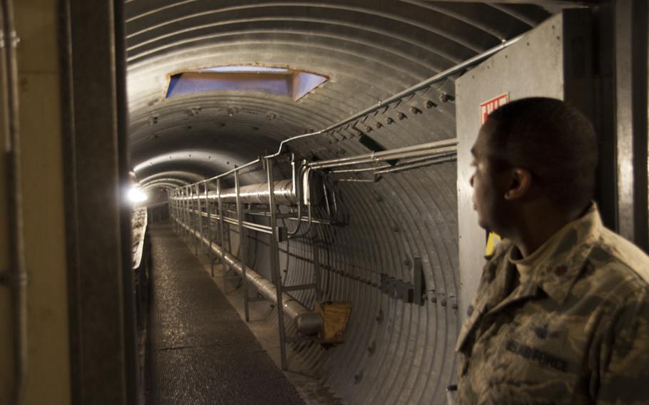Maj. Paul Lawson explains one of the passageways between the operations building and one of the radomes on Sept. 30. The corrugated steel is necessary in Thule’s brutal climate, where there is no sun for four months a year and brutal winter storms appear with little warning.