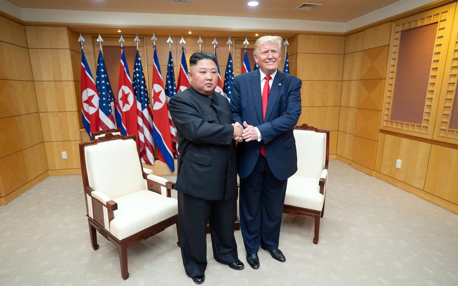Then-President Donald Trump and North Korean leader Kim Jong Un pose inside the Freedom House at the Demilitarized Zone between North and South Korea, June 30, 2019.