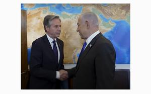 A video screen grab shows U.S. Secretary of State Antony Blinken shaking hands with Israeli Prime Minister Benjamin Netanyahu in Jerusalem on Wednesday, May 1, 2024.