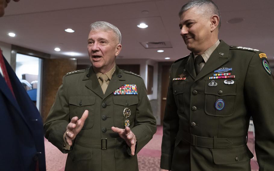Marine Gen. Kenneth McKenzie, commander of the U.S. Central Command, left, and Army Gen. Stephen Townsend, commander of the U.S. Africa Command, arrive to testify before the Senate Armed Services Committee as the panel holds a hearing on the readiness of the military in Africa and the Middle East, at the Capitol in Washington, on Tuesday, March 15, 2022.