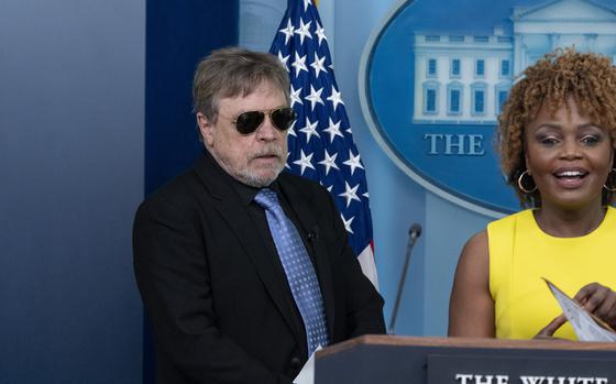 Actor Mark Hamill, left, joins White House press secretary Karine Jean-Pierre as she speaks with reporters in the James Brady Press Briefing Room at the White House, Friday, May 3, 2024, in Washington. (AP Photo/Alex Brandon)