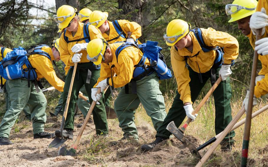 Oregon National Guard soldiers and airmen trained in June for the 2021 wildfire season. Troops are now deployed in the state, which is one of about 14 dealing with fires throughout the West.