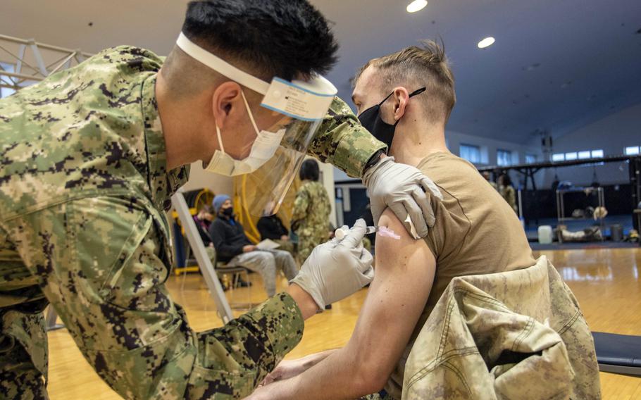 A sailor receives his first dose of the Moderna COVID-19 vaccine early this year at Yokosuka Naval Base, Japan. 