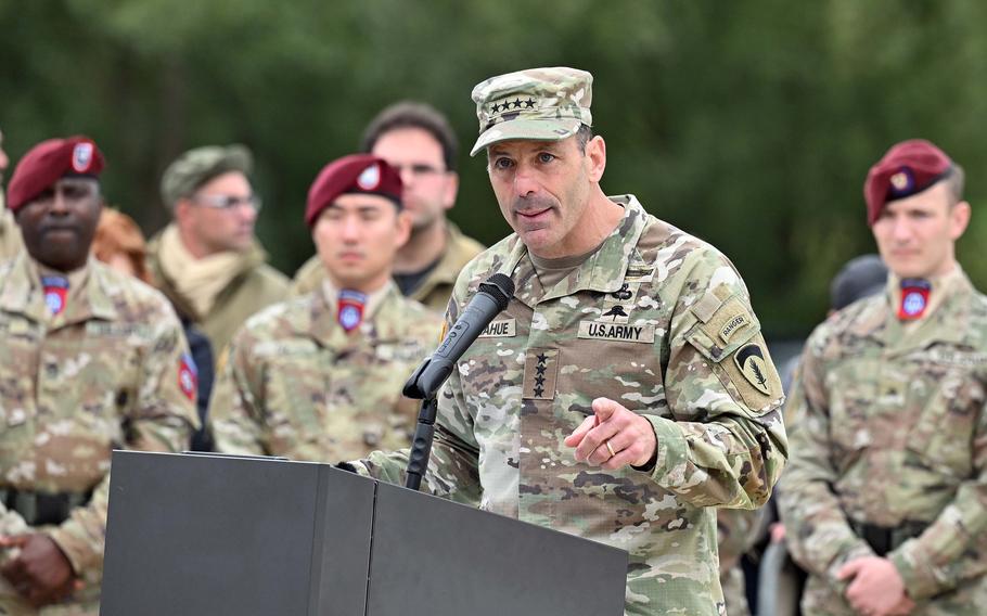 A soldier speaks at a podium.