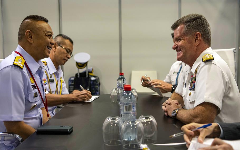 Adm. Samuel Paparo, right, commander of U.S. Pacific Fleet, meets with the head of the Thai navy, Adm. Adoong Pan-iam, during the Indo Pacific International Maritime Exposition in Sydney, Nov. 7, 2023.