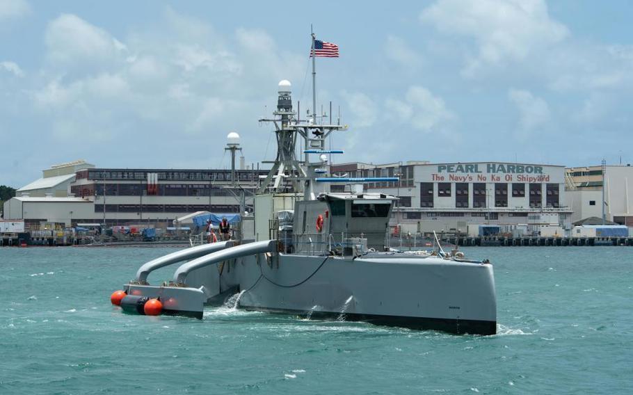 In this image provided by the U.S. Navy, a Sea Hunter, a crewless vessel, arrives at Pearl Harbor, Hawaii, to participate in the Rim of Pacific (RIMPAC) 2022, on June 29, 2022. The Navy is expediting development of drone ships aimed at expanding the reach of offensive firepower while keeping sailors on traditional warships farther from harm's way. (U.S. Navy photo by Mass Communication Specialist 2nd Class Aiko Bongolan, via AP)