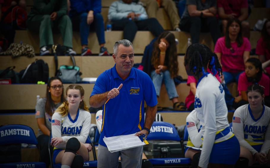 Sigonella Jaguars coach Shawn McCarthy cheers on  Rickalia Goss after his team scored a point during the 2022 DODEA-Europe Volleyball Tournament Oct. 29, 2022, at Ramstein Air Base, Germany. 
