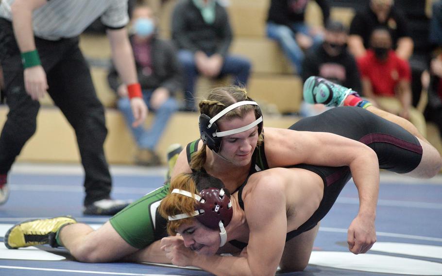 AFNORTH’s Paulo Aponte, top, defeated Vilseck’s Pierre-Jovan Fuentes in the 150-pound final at the high school 2022 Wrestling Tournament in Ramstein, Germany, Feb. 12, 2022.