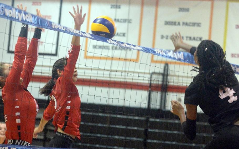 Robert D. Edgren freshman Elizabeth Johnson, right, had 20 kills in the Eagles' straight-sets win over E.J. King.