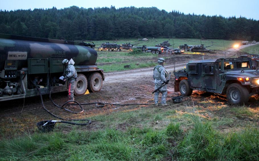 Army fuel specialists direct traffic while refueling diesel vehicles during an exercise in Hohenfels, Germany, in 2014. Authorities in Romania are investigating the theft of $2 million worth of fuel from the U.S. Army’s main military hub in that country.