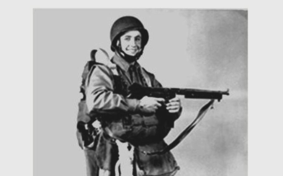 Army 1st Lt. William Hott holds a weapon and wears a helmet and uniform in a black-and-white photo. 