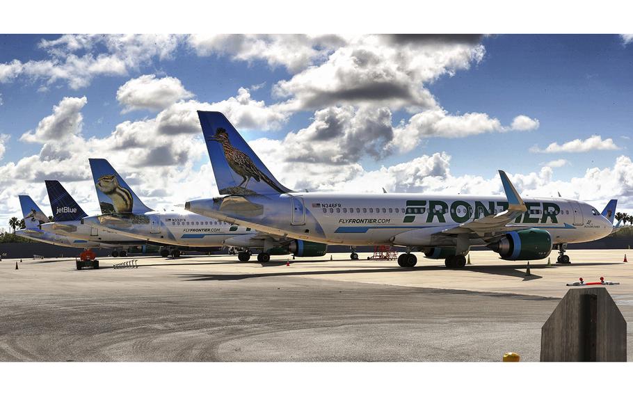 Frontier planes are parked at Orlando International Airport on April 7, 2020. A Tampa, Florida-bound jet was diverted to Atlanta late Friday, Nov. 11, 2022, after a passenger was spotted with a box cutter, the airline says. 