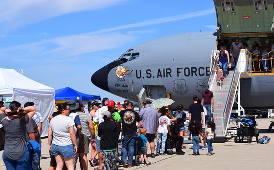 Air show enthusiasts stand in line to participate in a tour of the KC-135 Stratotanker assigned to the 452nd Air Mobility Wing, March Air Reserve Base, Calif. The Southern California Air Show showcased airframes from the U.S. Army, Navy, Marine Corps, Air Force, and several civilian aviation airframes in a family-friendly environment. March Field on April 12, 2025. (Released) (USAF Photo by Roy Santana)