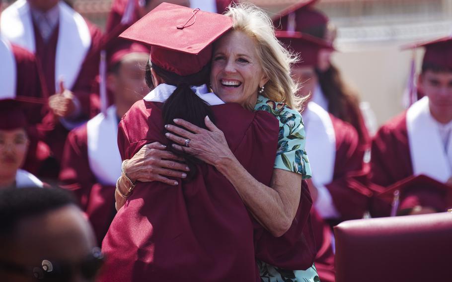 First lady Jill Biden congratulates Matthew C. Perry High School senior Trinity Downing during a pre-graduation ceremony at Marine Corps Air Station Iwakuni, Japan, Sunday, May 21, 2023. 