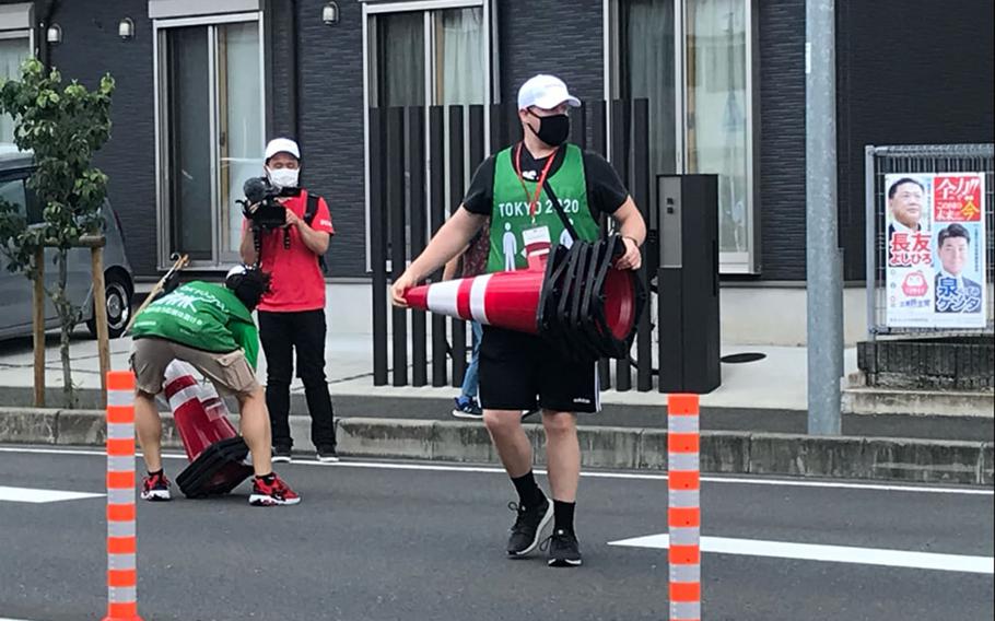 Over the course of the Olympics cycling event July 24-25, 2021, about 50 service members from Camp Zama volunteered to set up barriers and keep the 18 miles of roadway clear and safe.