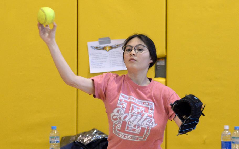 Junior Alyssa Marrero, one of four returning players from last season, limbers up during Robert D. Edgren Eagles softball practice.