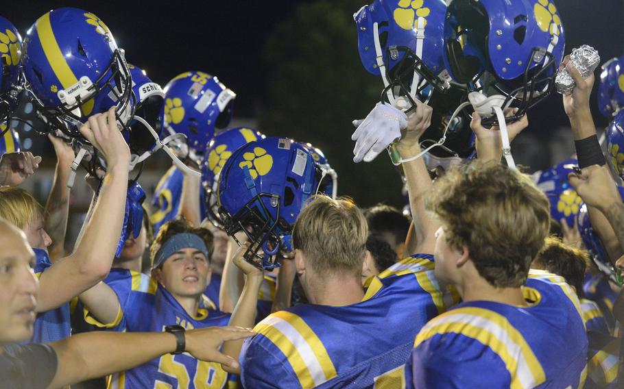 Panthers players break it down after their 31-0 win Friday over Matthew C. Perry.