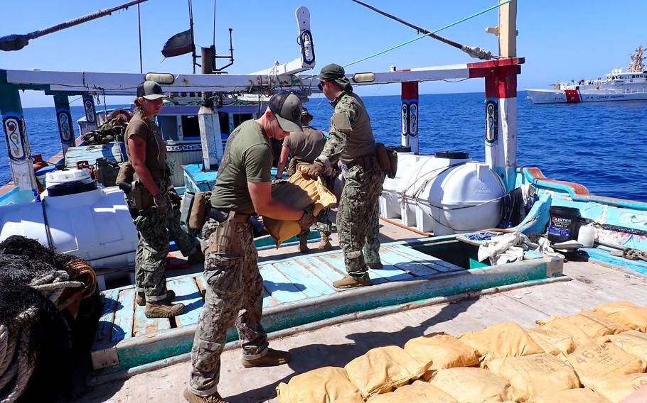 Crew members of the U.S. Coast Guard fast response cutter Glen Harris inventory drugs seized from a fishing vessel in the Gulf of Oman on Oct. 10, 2022.