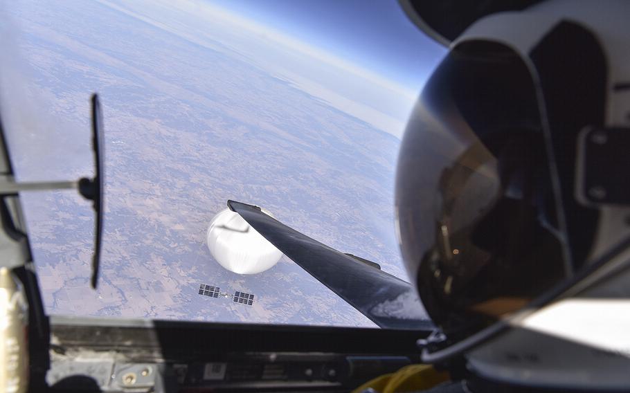 An Air Force pilot looks down at the suspected Chinese surveillance balloon as it hovered over the central continental United States on Feb. 3, 2023. Recovery efforts began shortly after the balloon was shot down Feb. 4 by a U.S. fighter jet over waters off the coast of South Carolina.