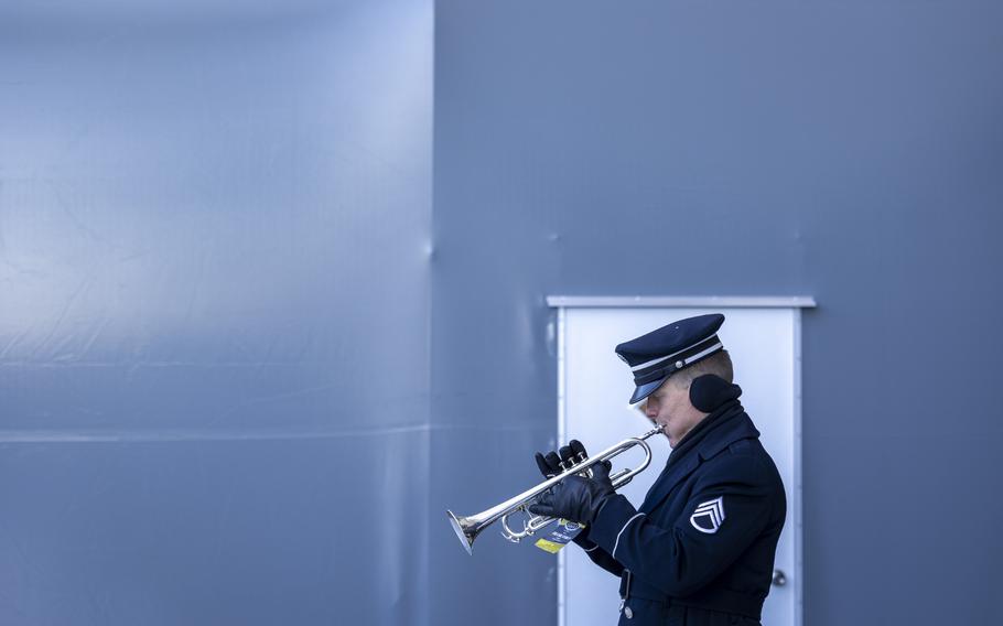 A trumpeter in the Army band warms up.