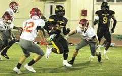 Kadena's Quince Reese finds daylight running against Nile C. Kinnick's defense.