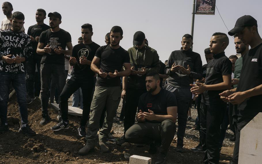 Palestinians attend the funeral of Firas Turkman, 22, who was killed in clashes with Israel Defense Forces in Jenin.