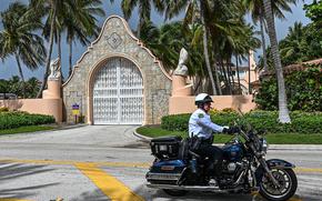 Local law enforcement officers are seen in front of the home of former President Donald Trump at Mar-A-Lago in Palm Beach, Florida on Aug. 9, 2022. - Former US president Donald Trump said Aug. 8, 2022, that his Mar-A-Lago residence in Florida was being "raided" by FBI agents in what he called an act of "prosecutorial misconduct." (Giorgio Viera/AFP via Getty Images/TNS)