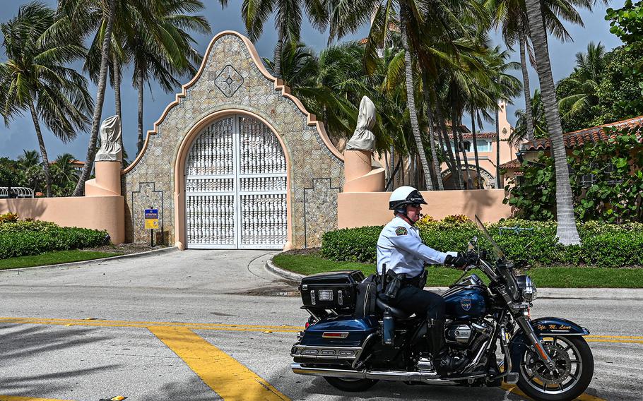 Local law enforcement officers are seen in front of the home of former President Donald Trump at Mar-A-Lago in Palm Beach, Florida on Aug. 9, 2022. 