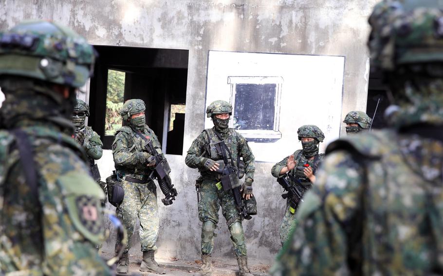 Soldiers participate in a military exercise simulating an invasion by China, organized by Taiwan’s Army Infantry Training Command, in Kaohsiung, Taiwan, on Jan. 6, 2022. 