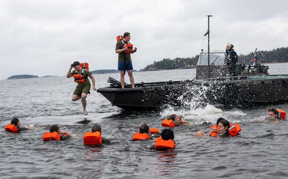 U.S. Marines abandon ship during man overboard drills off the coast of Finland, Nov 14, 2023. The Marines are assigned to Combat Logistics Battalion 6, Combat Logistics Regiment 2, 2nd Marine Logistics Group and are participating in exercise Freezing Winds 23.
