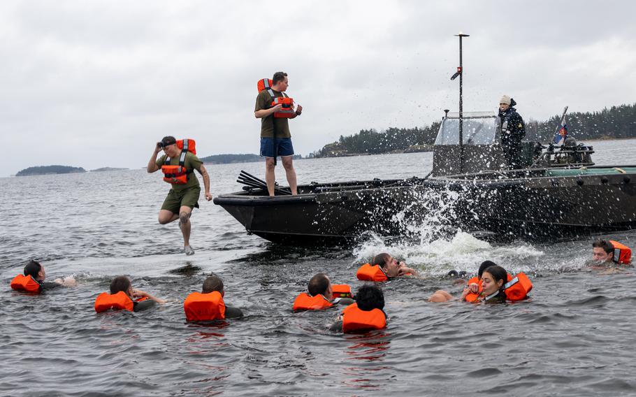 U.S. Marines abandon ship during man overboard drills off the coast of Finland, Nov 14, 2023. The Marines are assigned to Combat Logistics Battalion 6, Combat Logistics Regiment 2, 2nd Marine Logistics Group and are participating in exercise Freezing Winds 23.