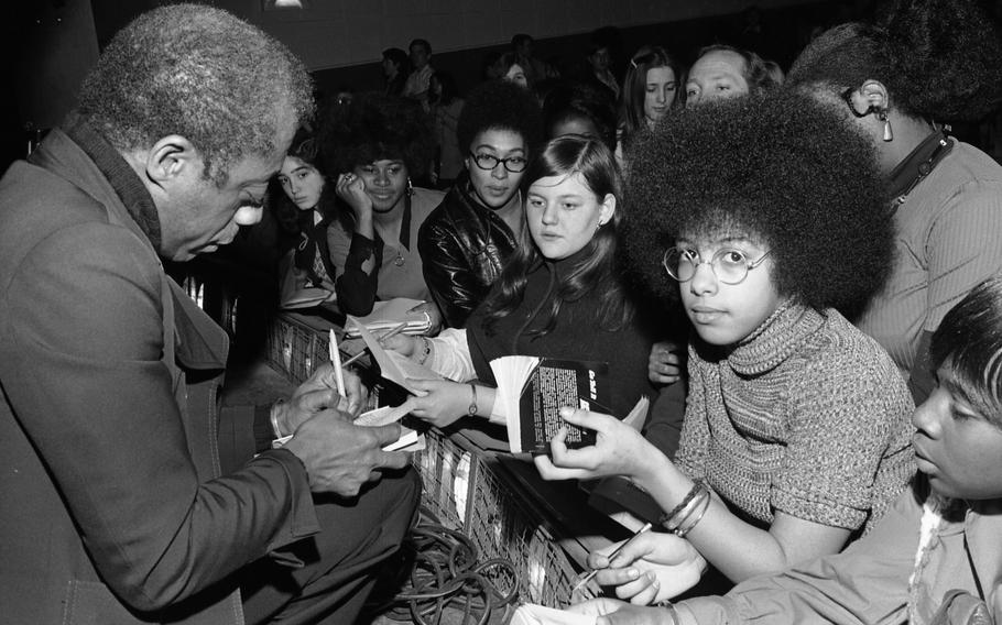 James Baldwin signs autographs at the Ludwigsburg High School, Feb. 16, 1973. 