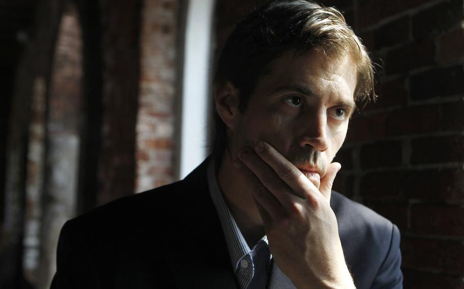 Journalist James Foley responds to questions during an interview in Boston on Friday, May 27, 2011. The family of slain American journalist Steven Sotloff filed a federal lawsuit Friday, May 13, 2022, accusing prominent Qatari institutions of wiring $800,000 to an Islamic State “judge” who ordered Sotloff’s and Foley’s murders.