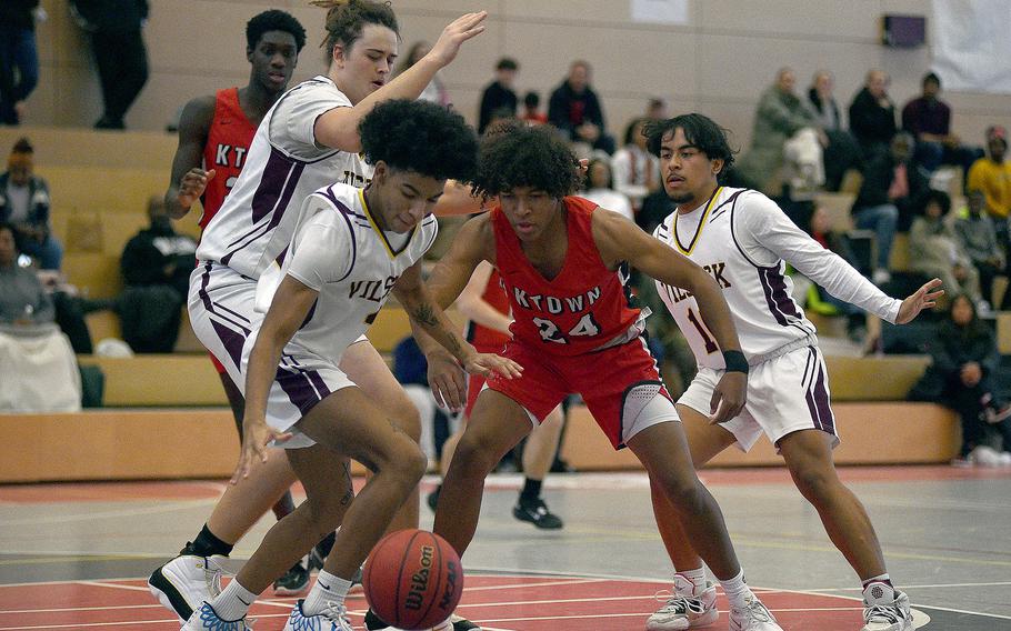 Vilseck's Ivan Ruffin steals the ball from Kaiserslautern's Rueben Todman during a Dec. 2, 2023, game at Kaiserslautern High School in Kaiserslautern, Germany