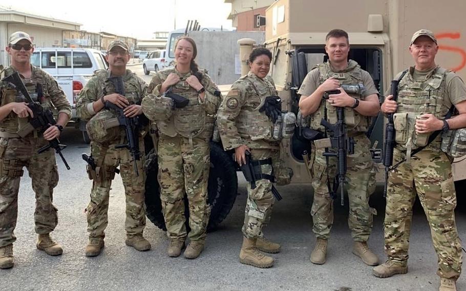 Members of the 379th Expeditionary Aeromedical Squadron pose for a photo in Kabul, Afghanistan, Aug. 26, 2021. From left, Senior Airman Morgan Reed, Capt. Carlos Mendoza, Capt. Kayleigh Migaleddi, Master Sgt. Dalphne Charlesworth, Capt. Jon Ashman and Maj. Jayde Sharp. Mendoza and Reed were each awarded the Bronze Star for their actions in the aftermath of the Abbey Gate suicide bombing outside the Kabul airport in August 2021. Reed has since been promoted to a staff sergeant.