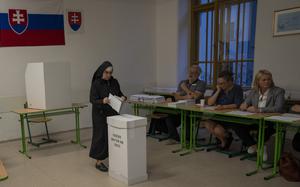 A Catholic nun casts her ballot at a polling station in Bratislava, Slovakia, Saturday, Sept. 30, 2023. Slovakia holds an early parliamentary election that pits populist former Prime Minister Robert Fico who campaigned on a clear pro-Russia and anti-American message against a liberal pro-West newcomer. (AP Photo/Darko Bandic)