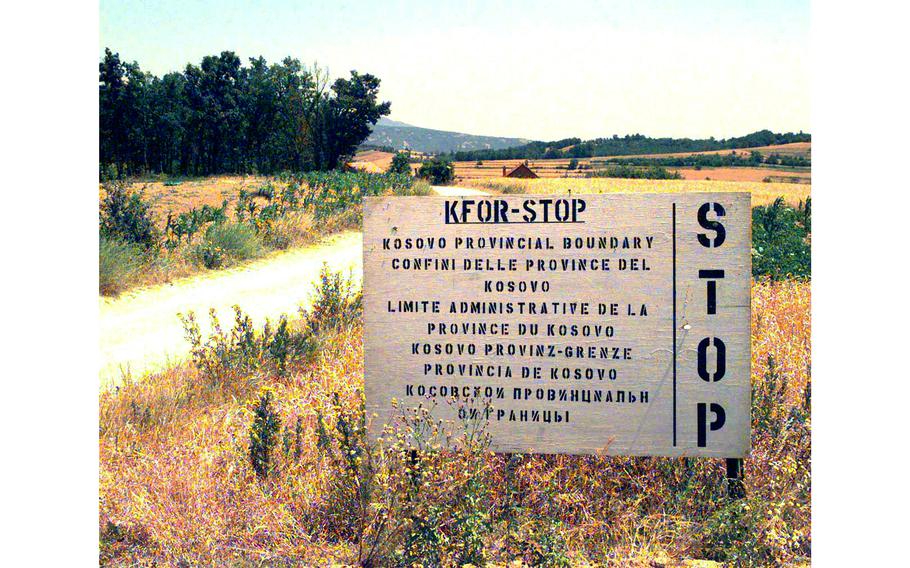 KFOR warning signs mark the provincial border of Serbia at Checkpoint Sapper, Kosovo, July 6, 2000.