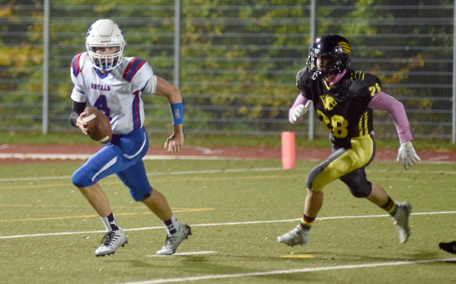 Ramstein quarterback Lucas Hollenbeck tries to scramble away from Stuttgart’s Levi Katzenberger during a DODEA-Europe Division I semifinal Friday evening in Stuttgart, Germany.