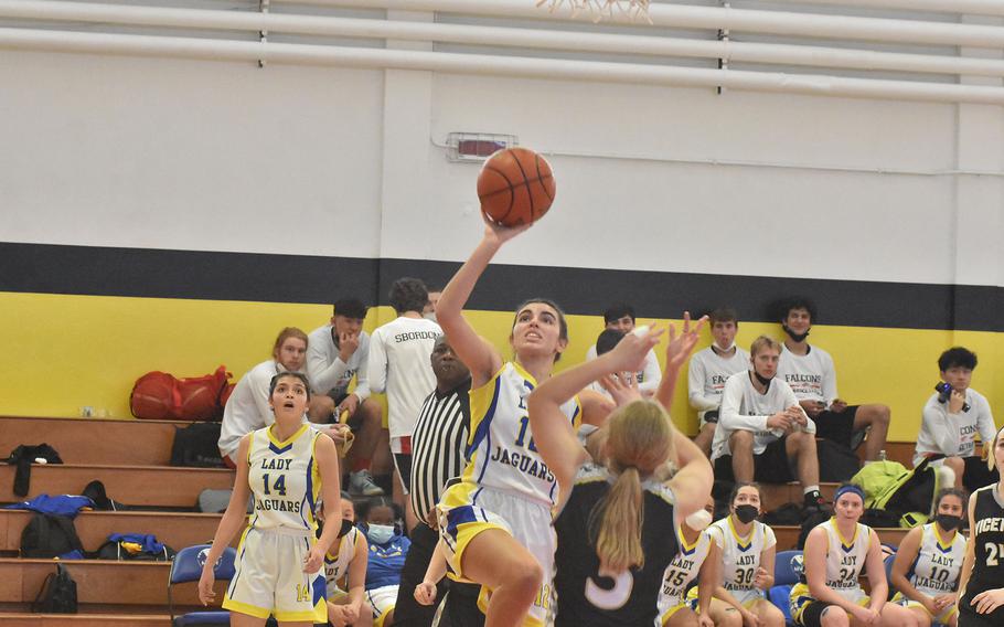 Sigonella's Fabiola Mercardo-Rodriguez takes a shot Thursday, March 3, 2022, while guarded by Vicenza's Makenzie Blue during the DODEA-Europe Division II basketball championships.