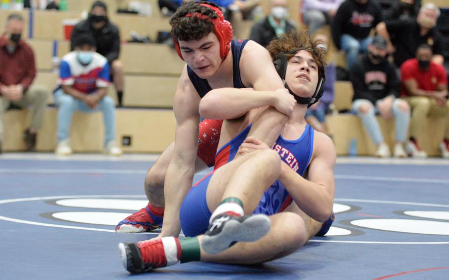 Lakenheath’s Stephen Kofron, left, and Ramstein’s Caden Umphlet-Martinez grapple in an exciting 165-pound title match won by Kofron in overtime, at the high school 2022 Wrestling Tournament in Ramstein, Germany, Feb. 12, 2022.